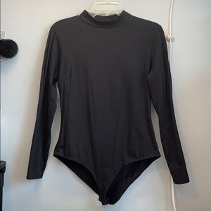 Never worn. Black onesie